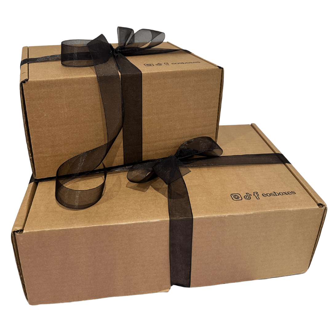 Two bespoke corporate gift boxes stacked on top of each other wrapped in black velvet ribbon
